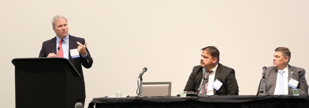 Eric Cote, left, speaks at the California Hospital Association’s 2023 Emergency Preparedness Summit on October 5, 2023 where he and his LA County EMS Agency clients introduced the Healthcare Facility Emergency Power Resilience Playbook. With Cote are EMS Agency officials Chris Sandoval, Disaster Services Manager (center), and Terry Crammer, Chief, Disaster Services (right). 